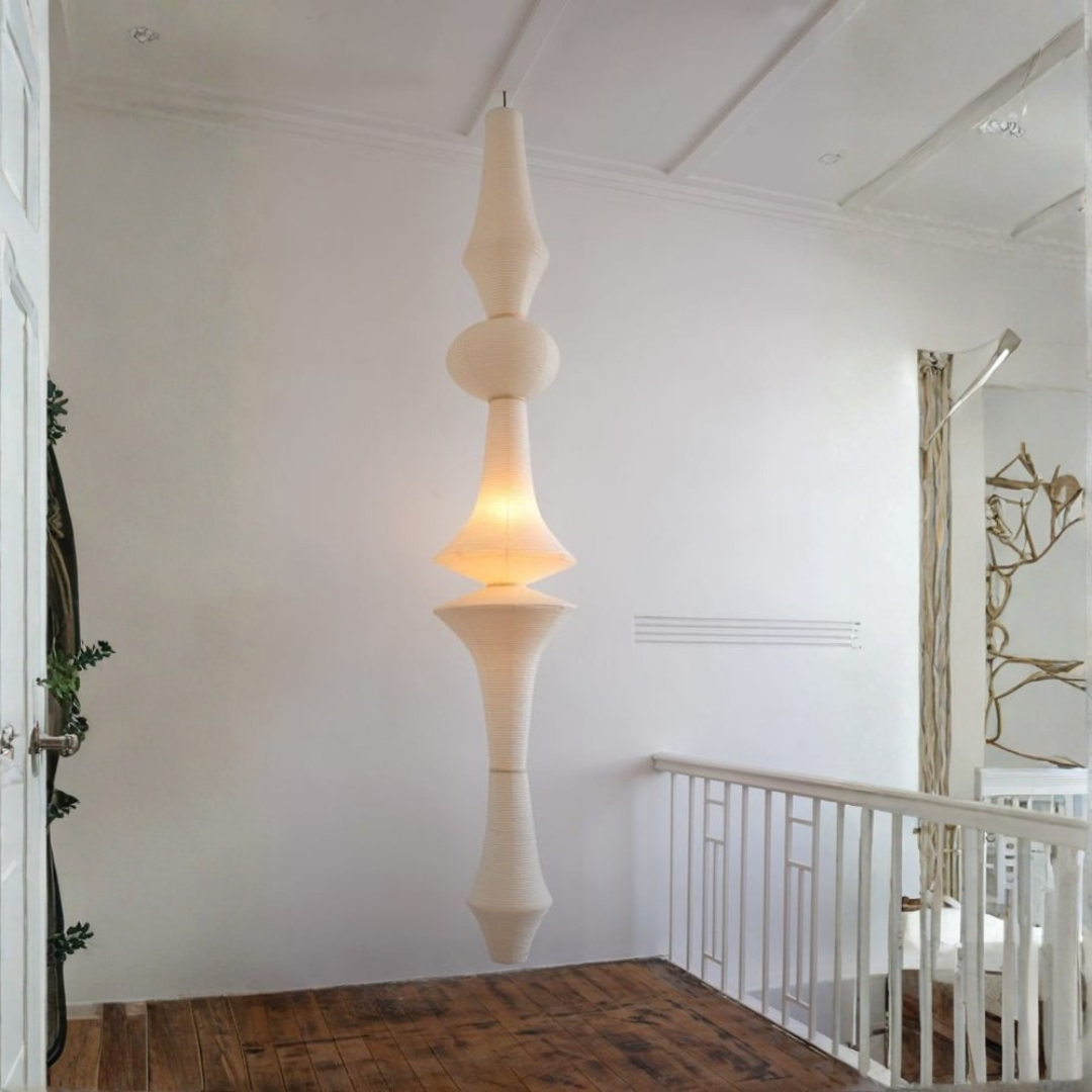 Glowing Japandi paper totem light above wooden landing