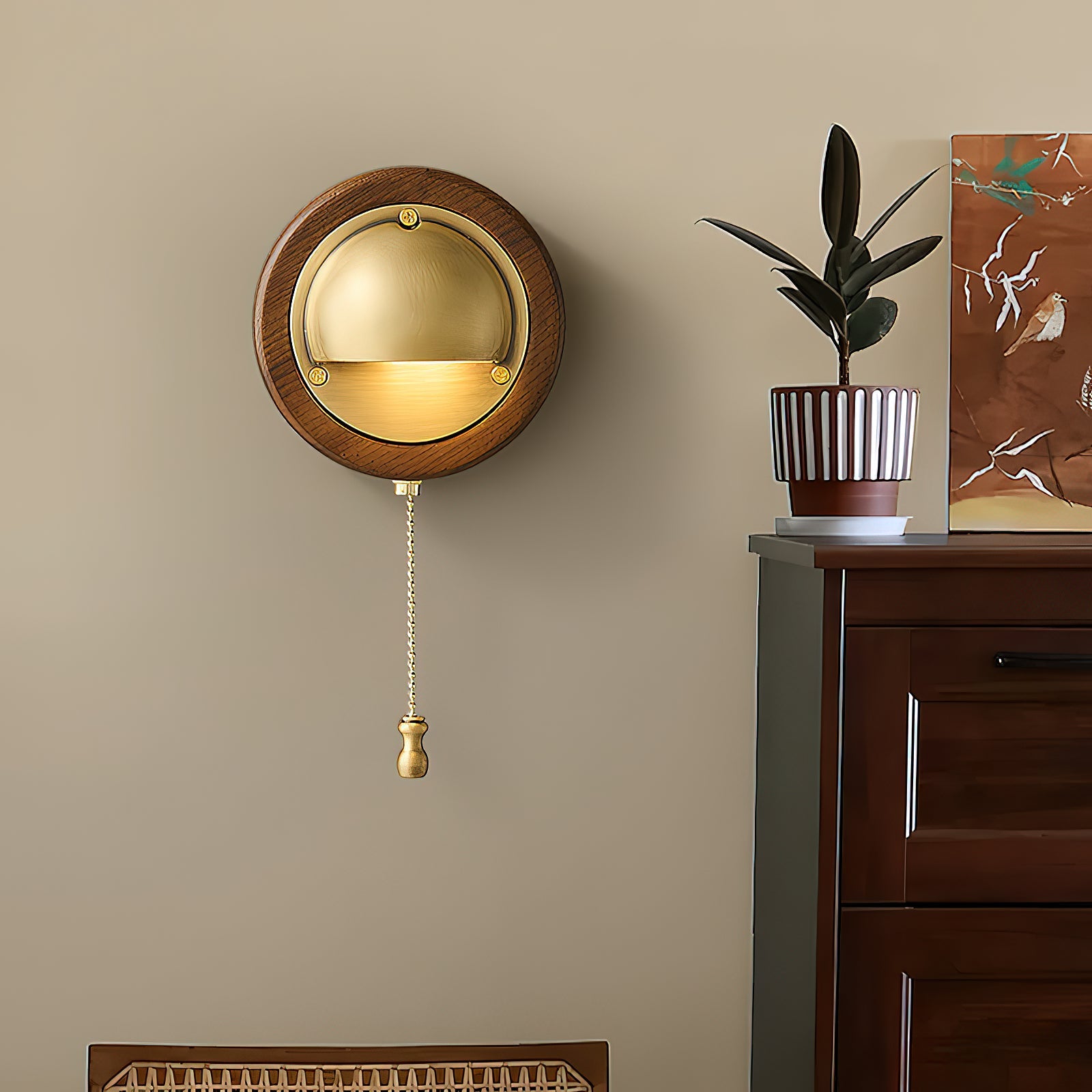 Vintage brass and wood wall sconce casting warm glow in living room setting
