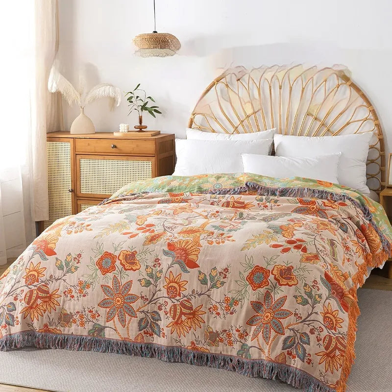 Boho floral bed sheet set draped over rattan headboard with white pillows