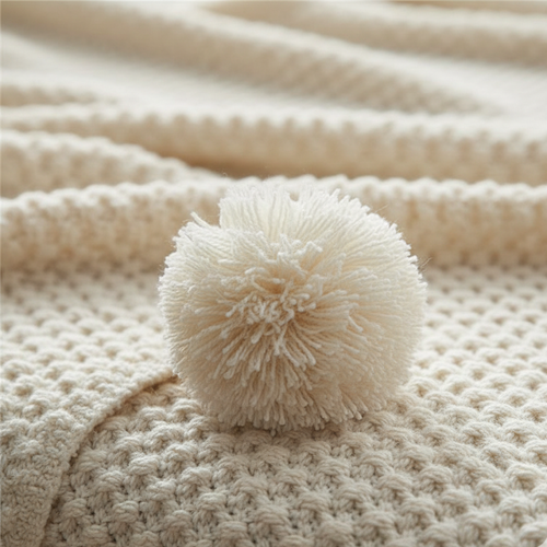 Scandinavian Textured Knitted Blanket - Decorative Pom-Pom Trim - Dense Nordic Seed Knit Accent Throw