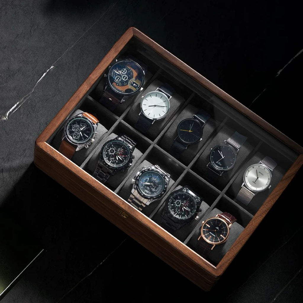 Walnut 10-slot glass top watch box with brass latch holding leather and metal watches