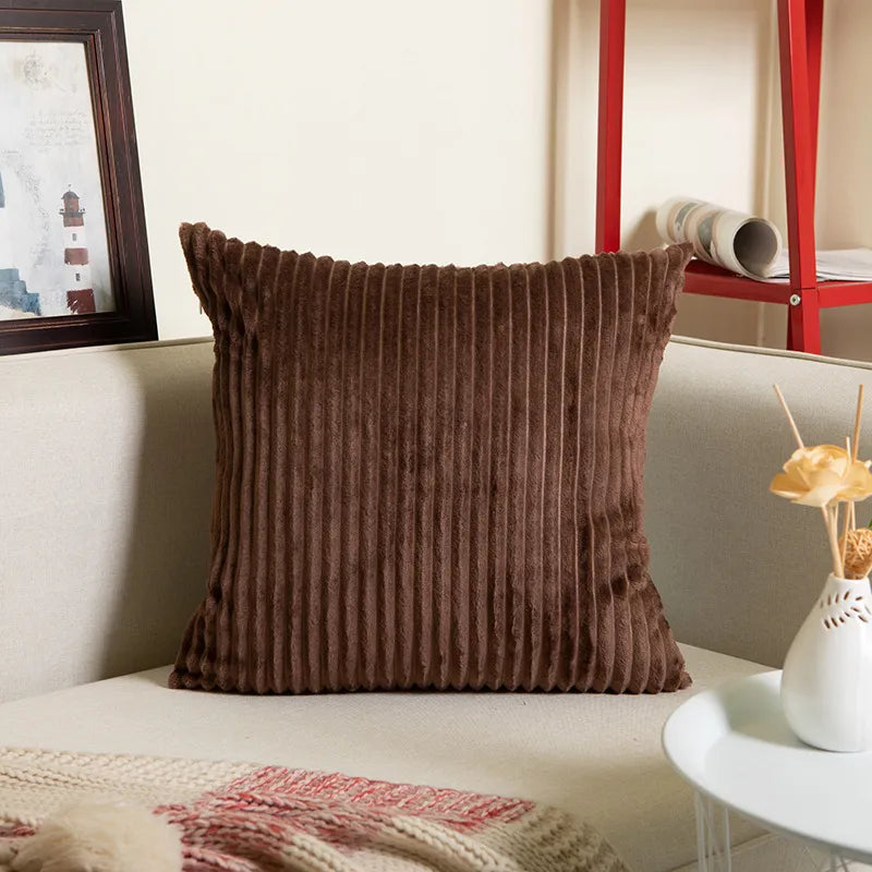 Brown ribbed flannel square pillowcase with corduroy detail on beige sofa