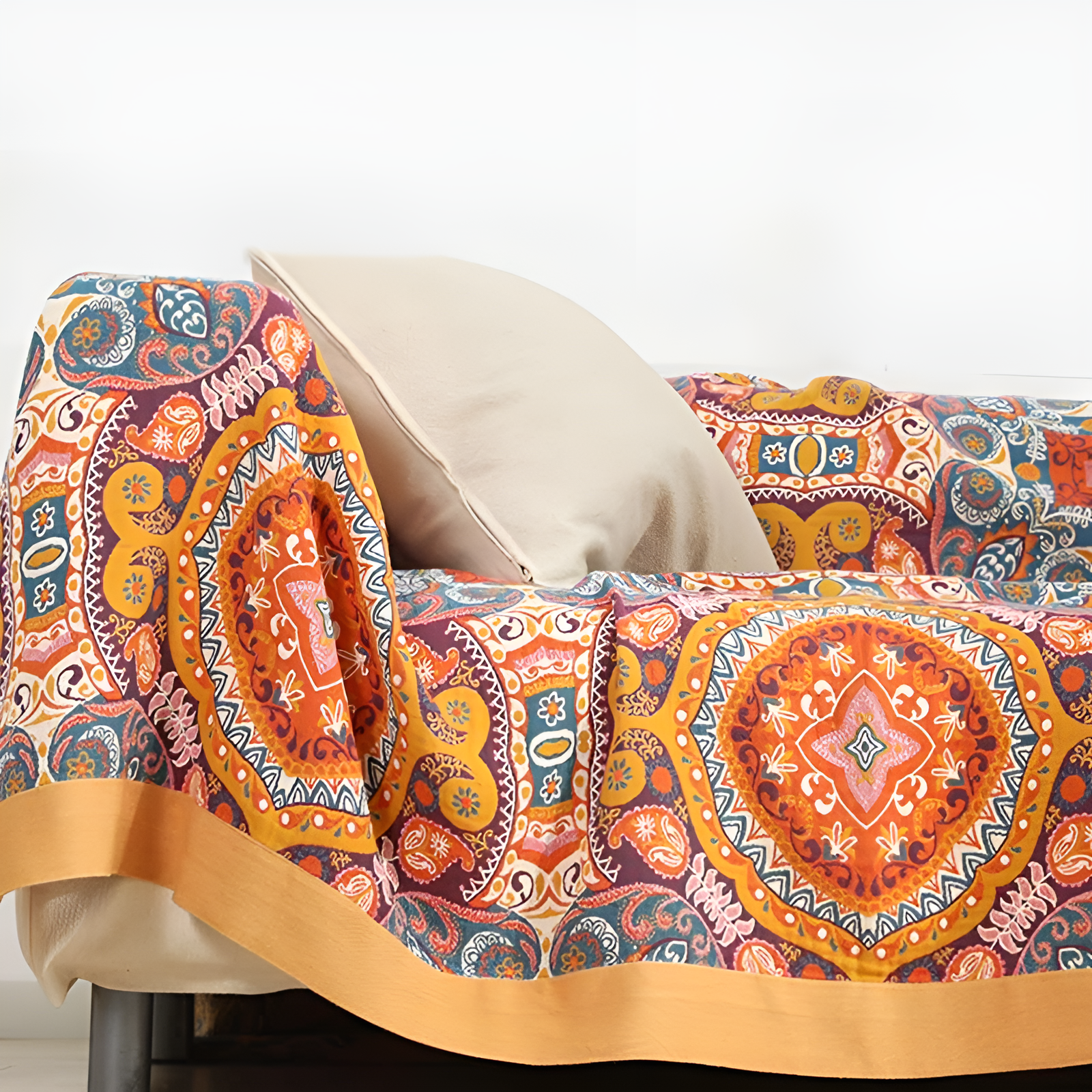 Close-up of Sunrise Boho reversible blanket on sofa armrest highlighting woven texture