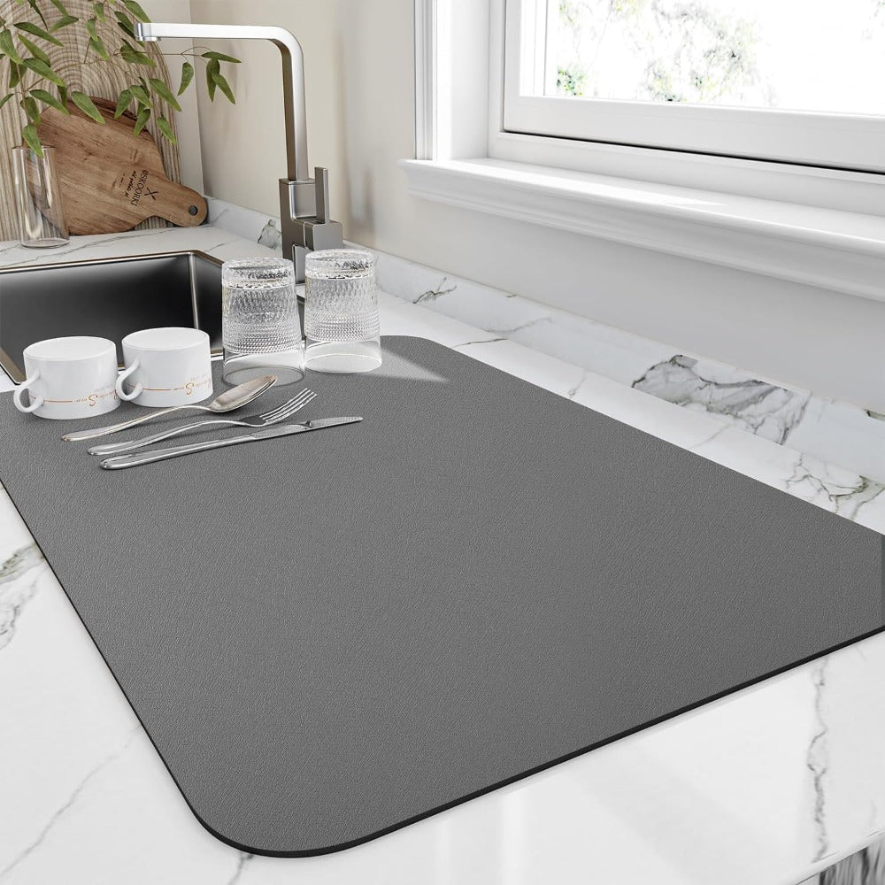 Gray super absorbent dish mat with textured surface on marble counter