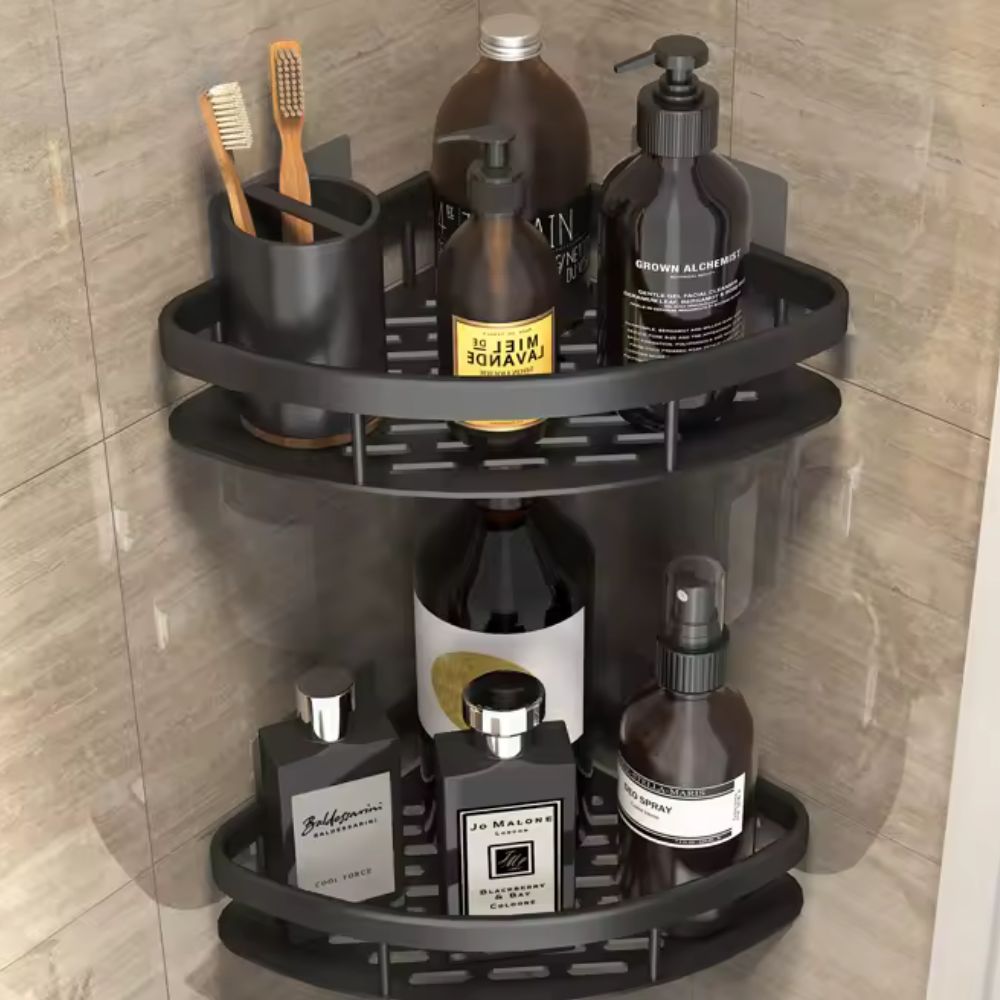 Black two-tier corner shower organizer holding toiletries with perforated drainage shelves