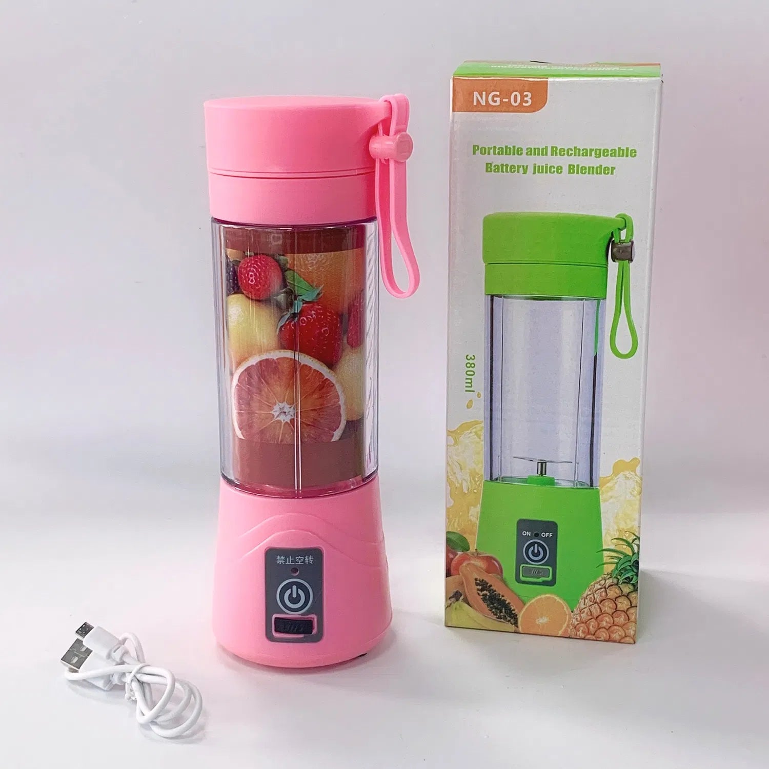 Pink portable USB rechargeable smoothie blender with fruit, carrying strap and box