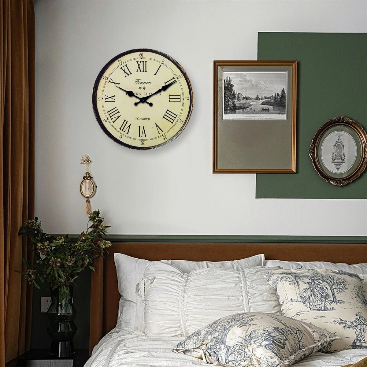 Vintage French wall clock with Roman numerals and distressed frame in bedroom setting
