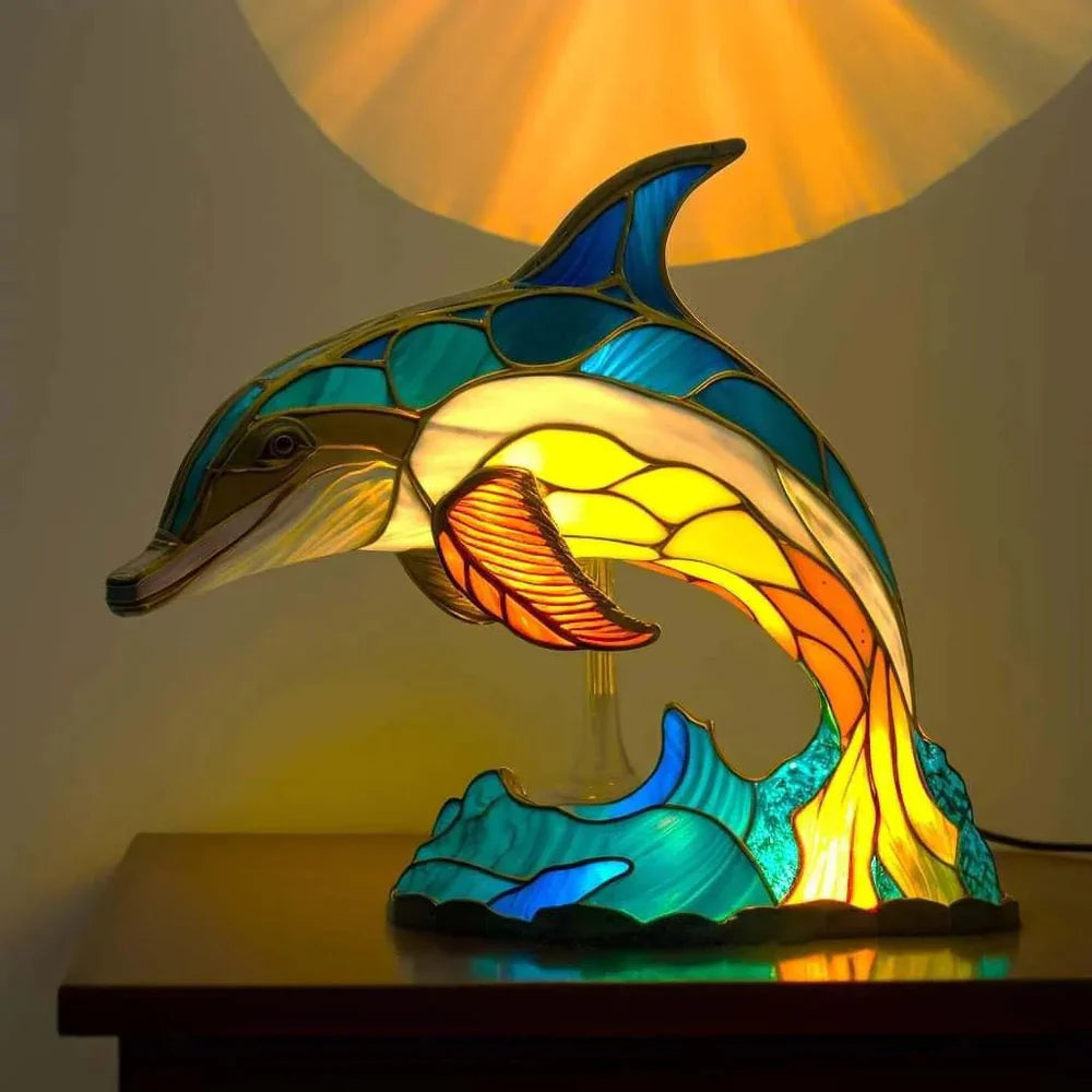 Dolphin mid-leap stained glass table lamp on wave base