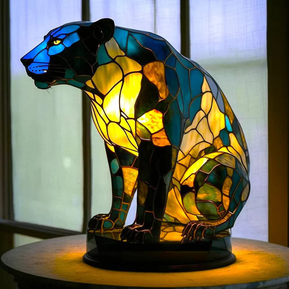 Seated panther stained glass table lamp with glowing yellow eyes
