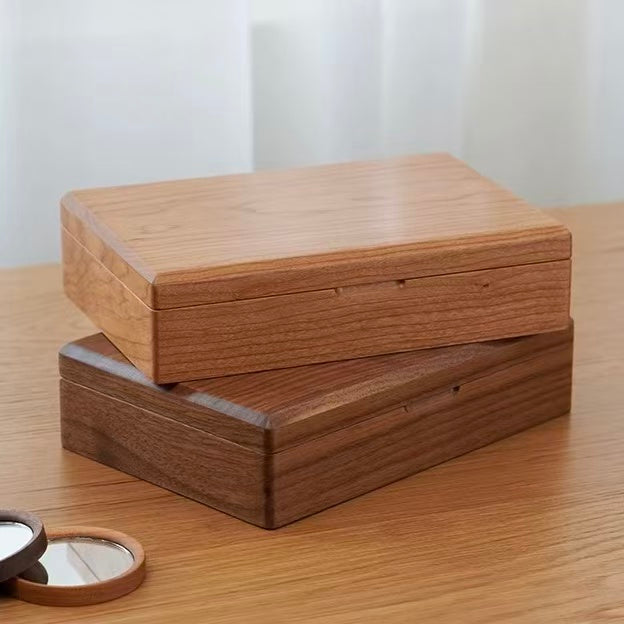 Stacked light and dark walnut jewelry boxes with wooden mirror