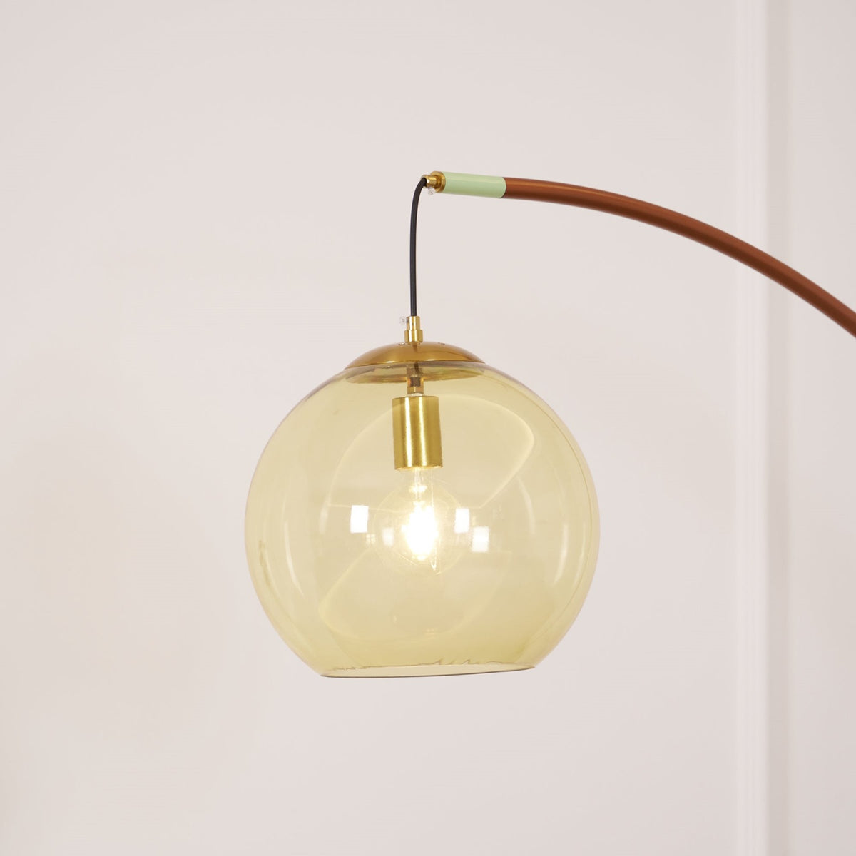 Maintained House Amber Globe Arc Floor Lamp - Amber glass globe close-up