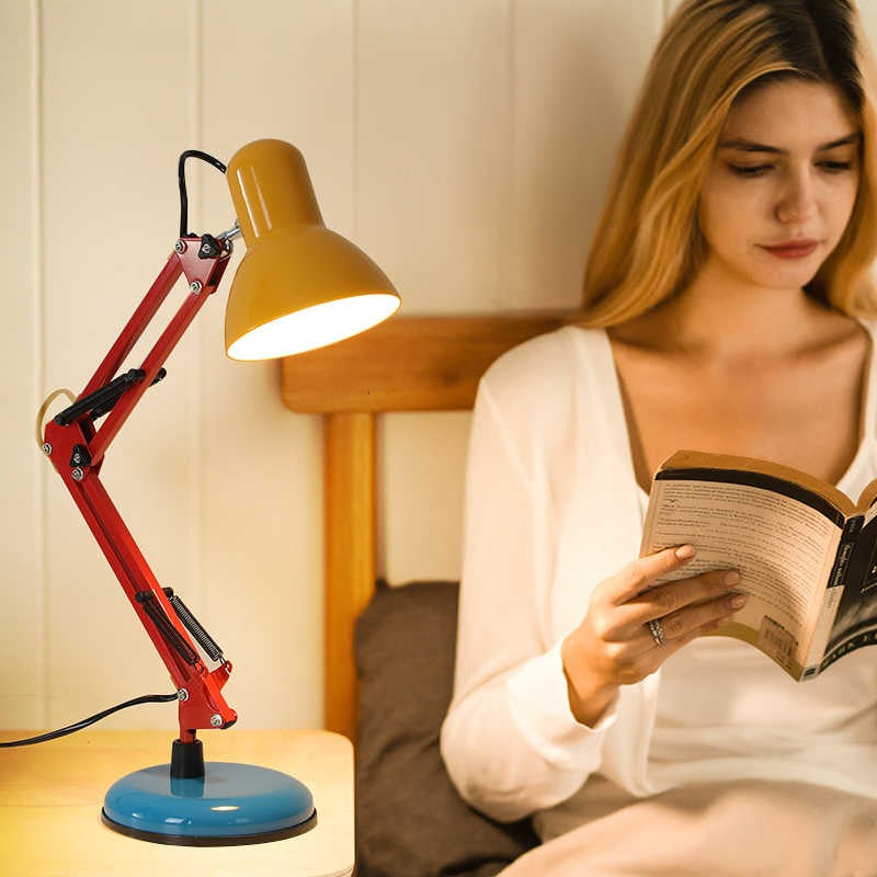 Maintained House Architect Desk Lamp - Color Block lighting a book in bed