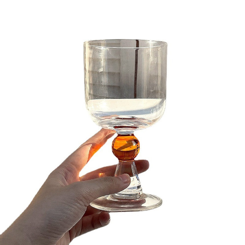 Maintained House Ball Stem Wine Glass Set - Holding the Amber glass