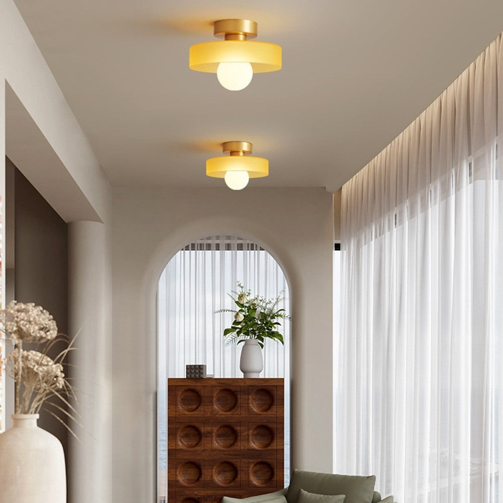 Maintained House Colored Glass Disc Ceiling Light - Two yellow lights along a hallway