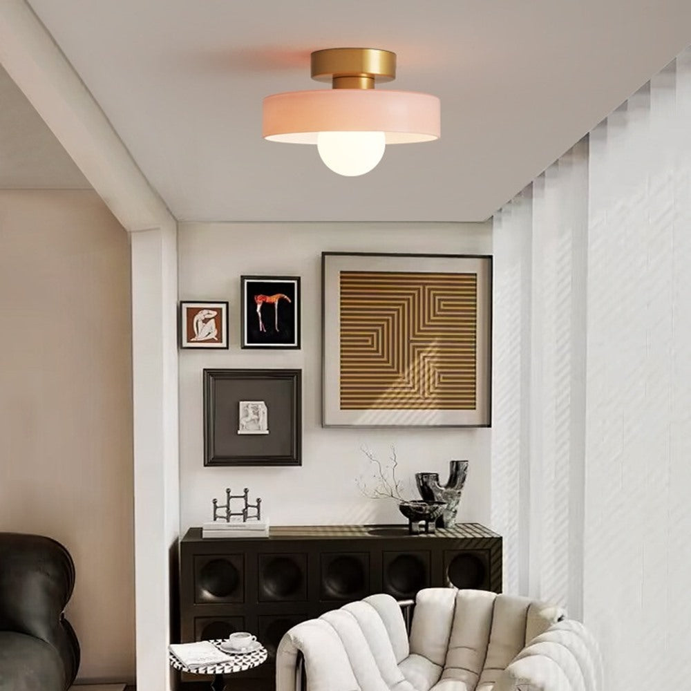 Maintained House Colored Glass Disc Ceiling Light - Pink light in a living room