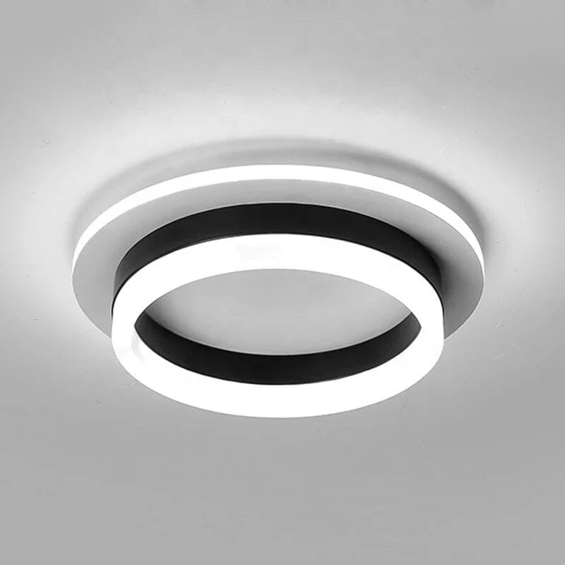 Maintained House Floating Ring LED Ceiling Light - Round, Black band, lit on a light gray ceiling
