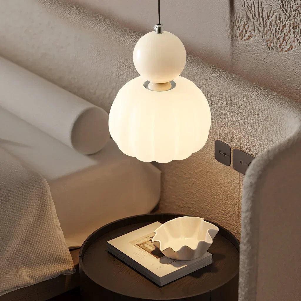 Maintained House Pumpkin Pendant Light - Single Pendant in Cream hanging low over a bedside table