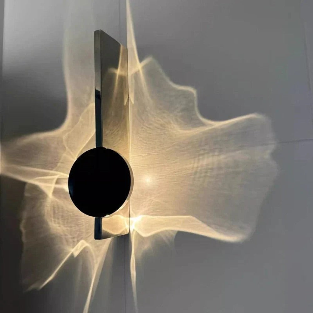 Maintained House Rotating Ripple Light Wall Sconce - Close-up of the chrome back plate and black head