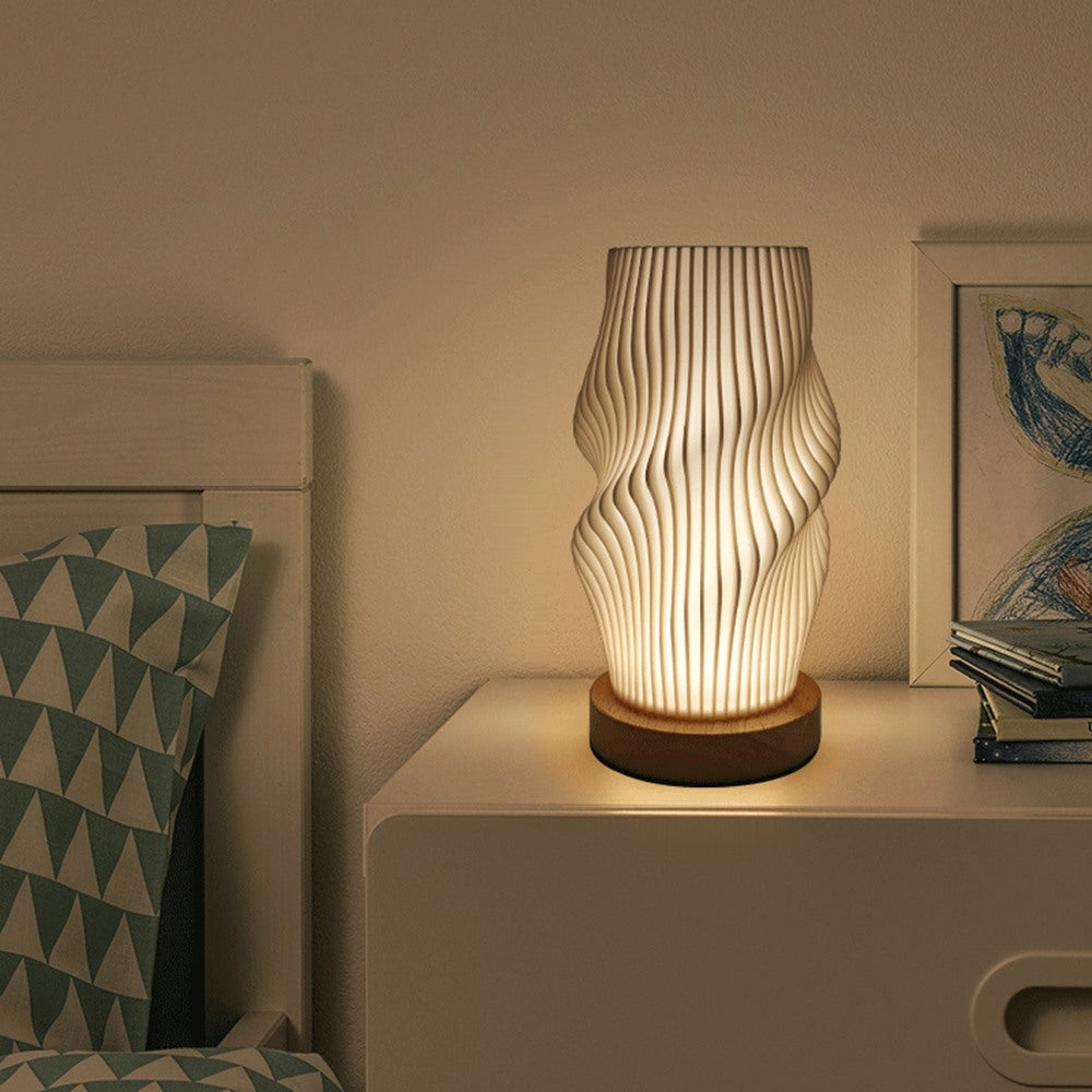 Maintained House Sculpted Wave Table Lamp - Ripple style on a nightstand