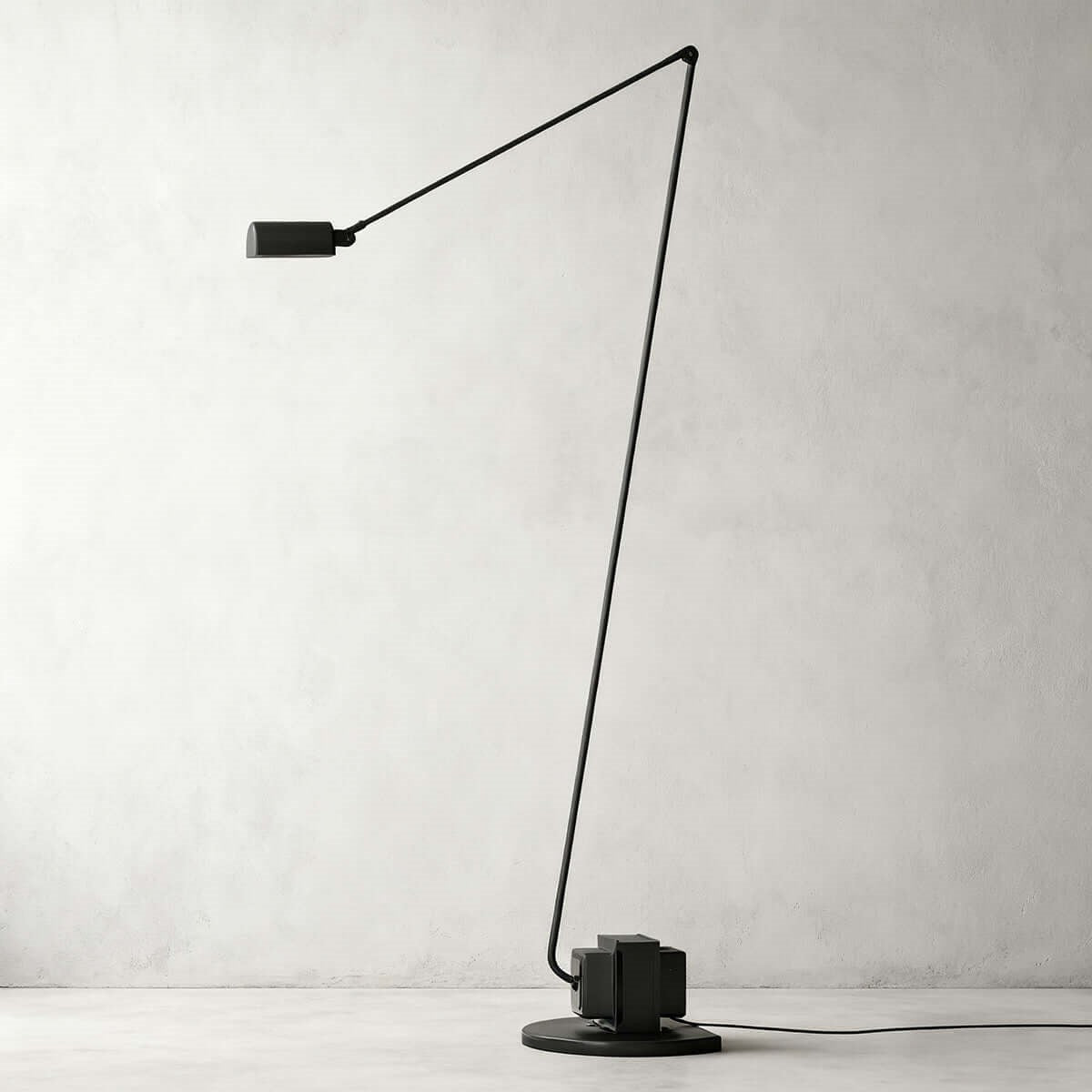 Maintained House Slim Swing Arm LED Floor Lamp - Against a plaster wall