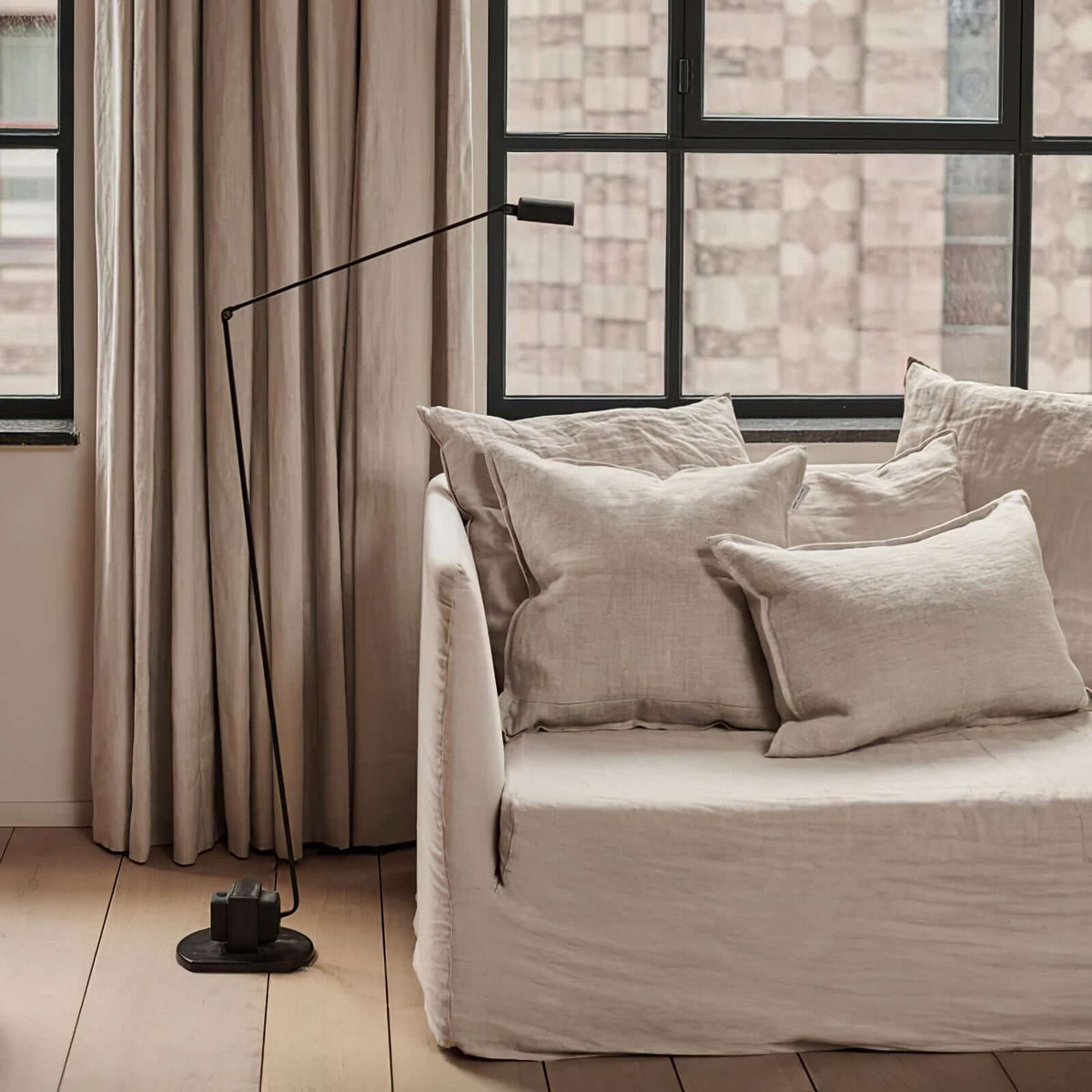 Maintained House Slim Swing Arm LED Floor Lamp - In a bright living room