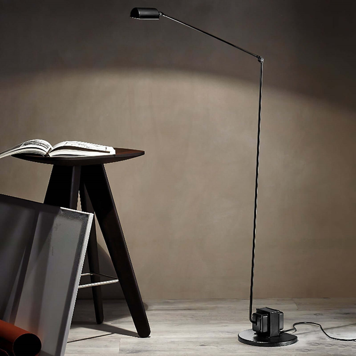 Maintained House Slim Swing Arm LED Floor Lamp - Beside a stool with an open book